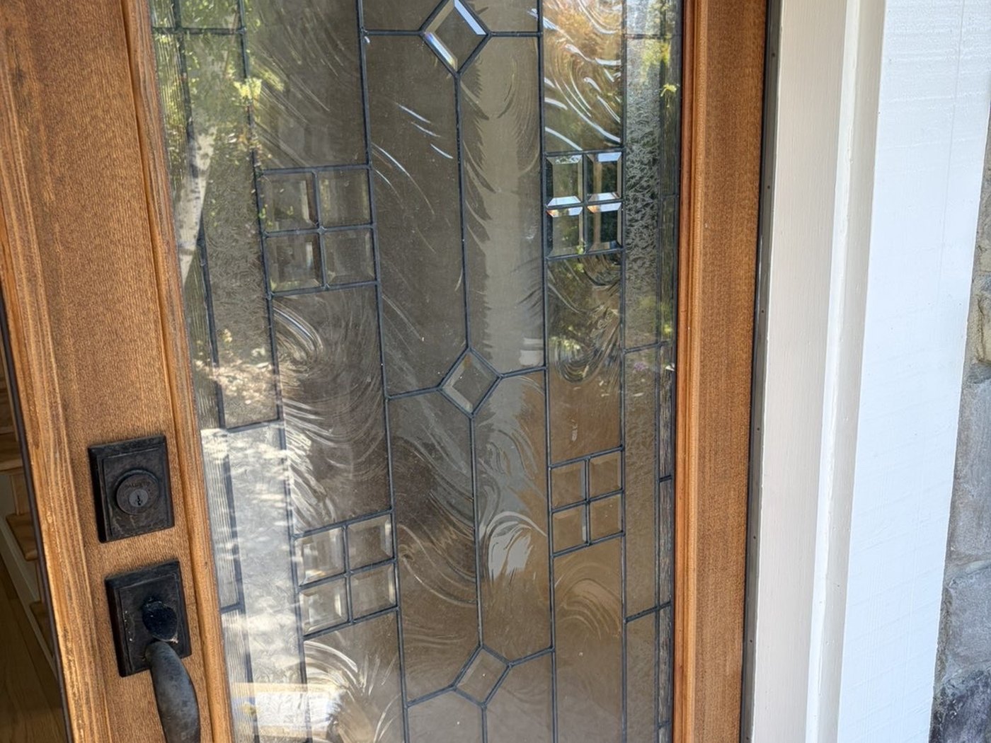 Leaded-glass entry door before cleaning, from outside